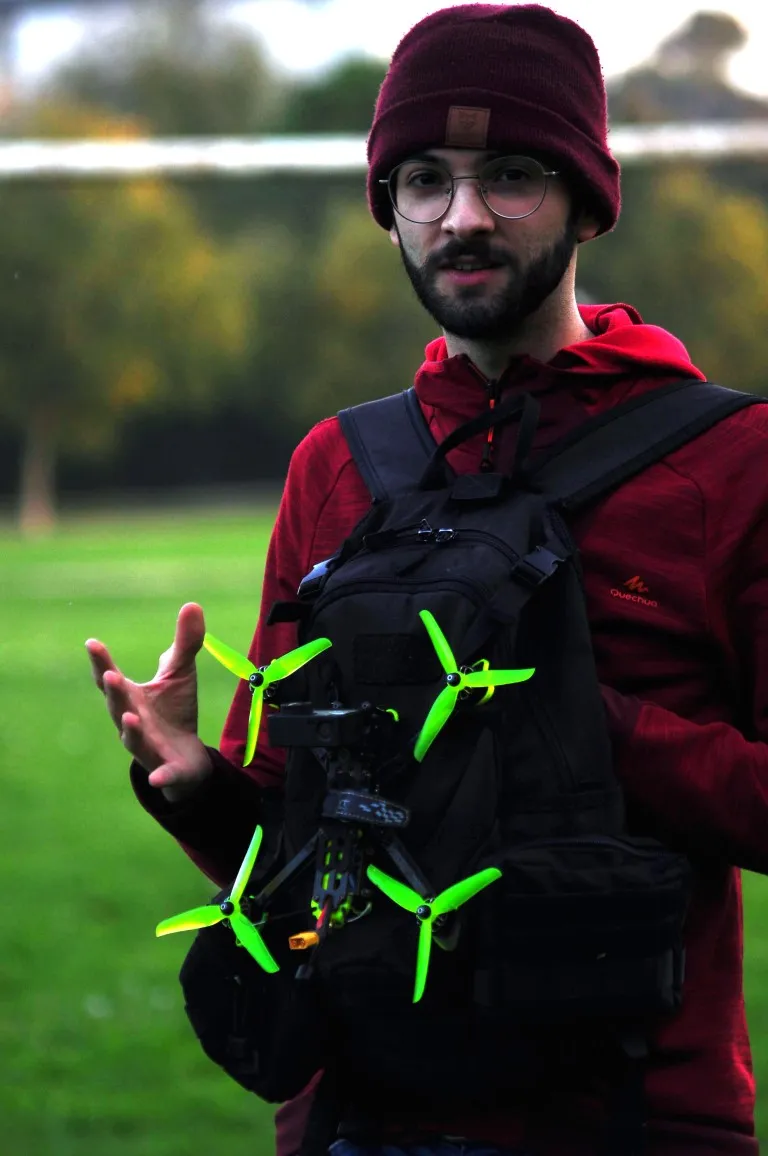 Ivan, founder of Drone FPV Stickers, holding his FPV drone